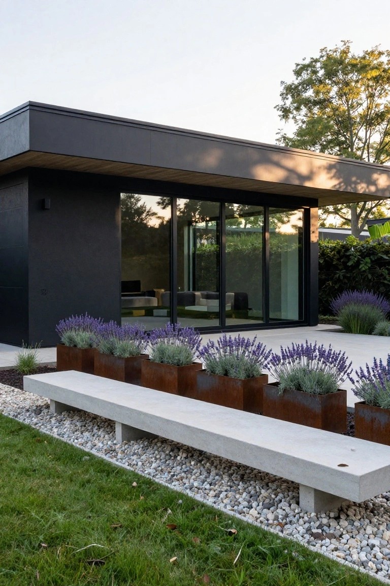 Modern dark house with concrete bench and rusted planters filled with lavender